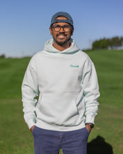A male golfer wearing Hirondelle Golf Hoodie Tee Time is Me Time to raise mental health awareness 