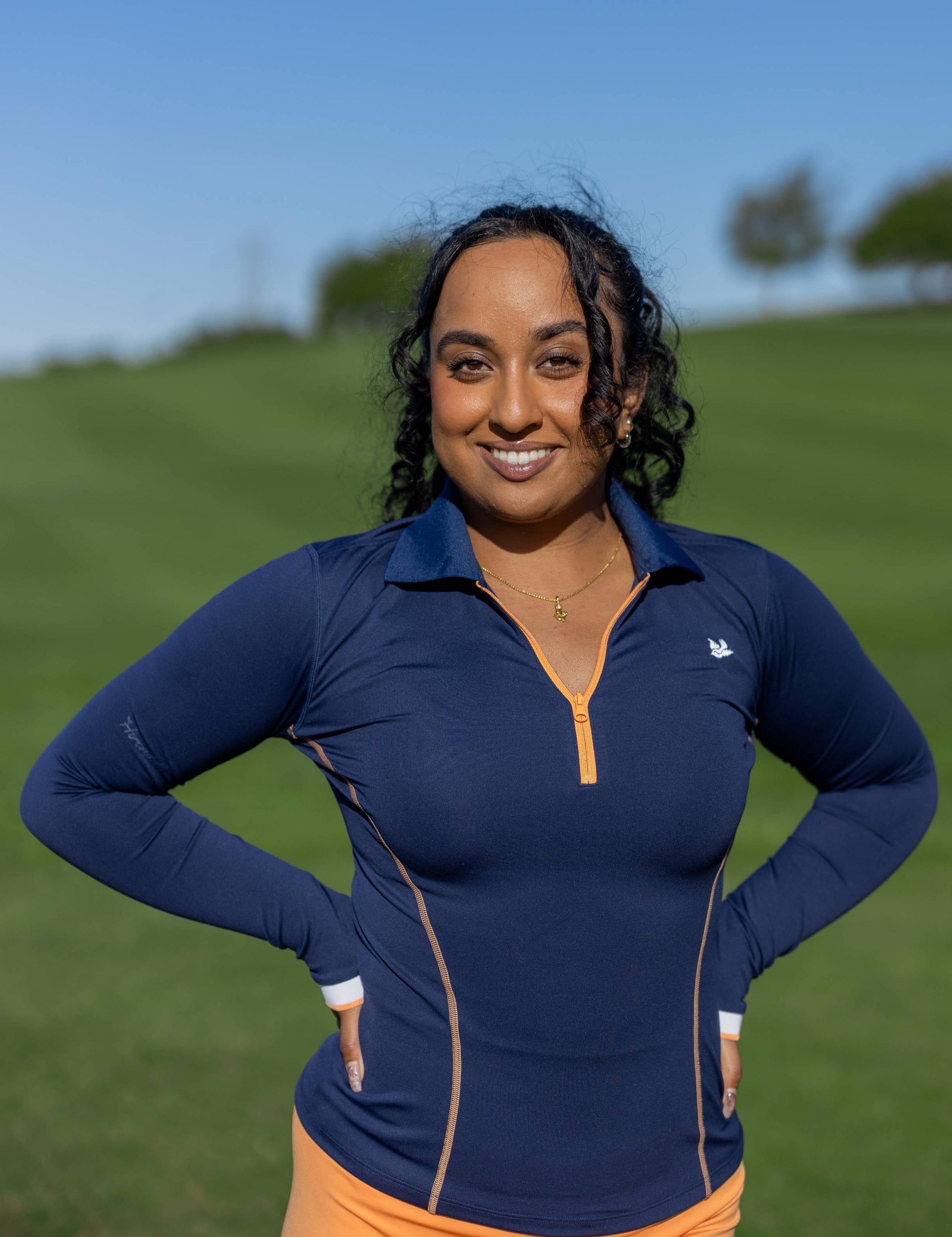 Hirondelle ImPak Long-sleeve polo in Navy front performance golf apparel for women asian athletic build modern