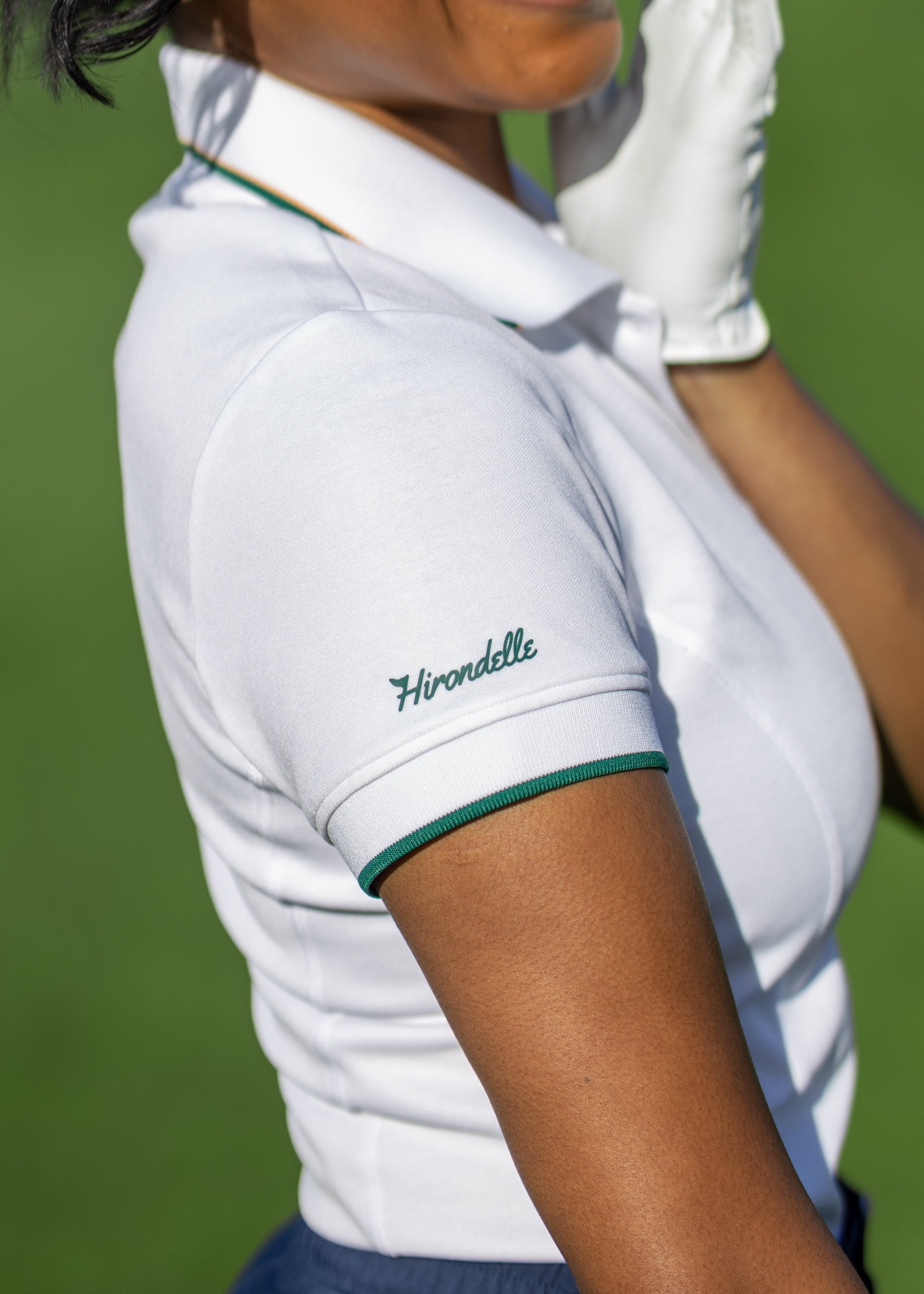 Hirondelle Koko Polo in white logo performance golf apparel women