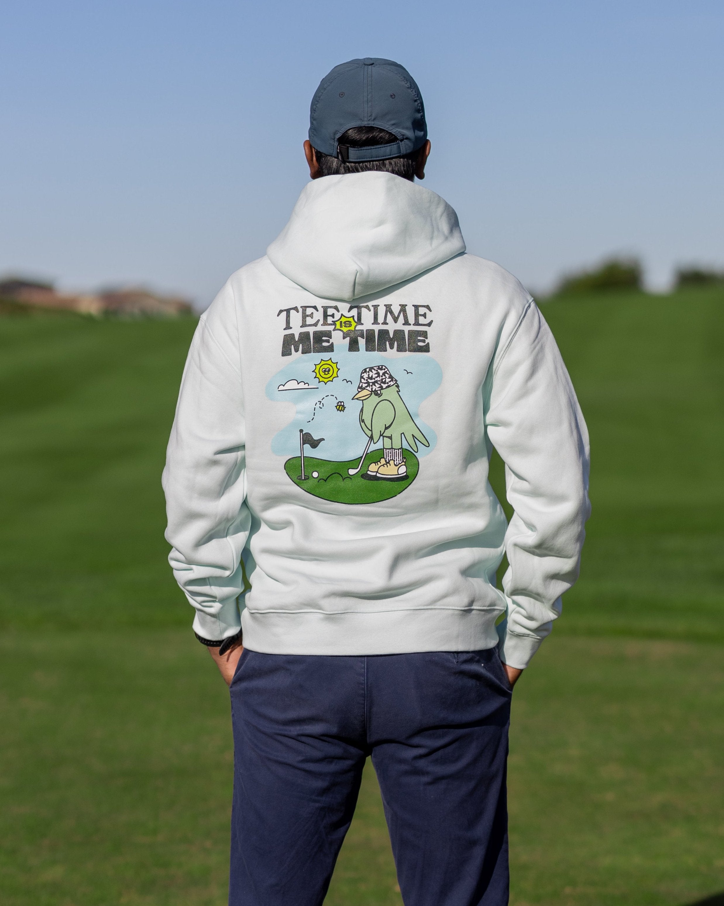 A male golfer wearing Hirondelle Golf Hoodie Tee Time is Me Time to raise mental health awareness 
