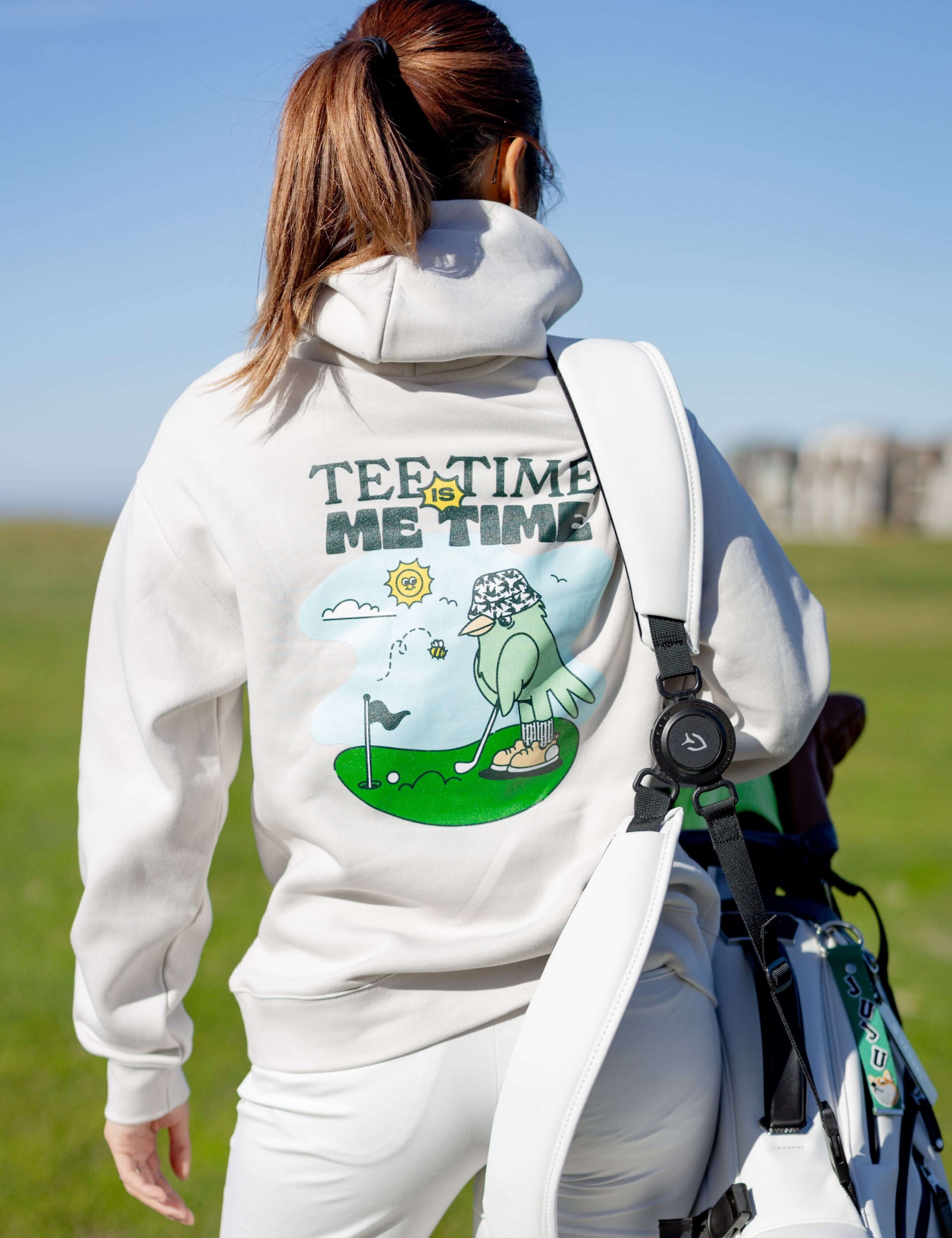 A female golfer wearing Hirondelle Golf Hoodie Tee Time is Me Time to raise mental health awareness 